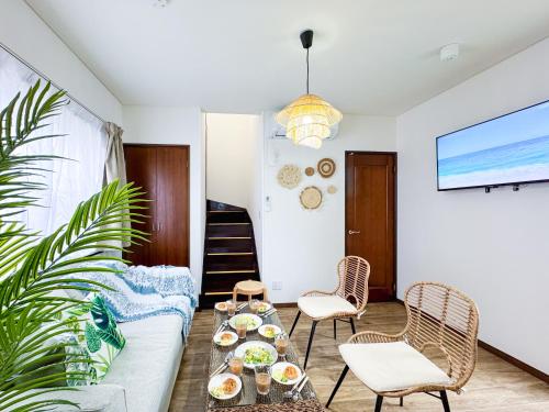 a living room with a couch and a table at #43 Sajima nagi in Yokosuka