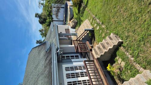 an aerial view of a house on a hill at French Panorama Resort in Dauis