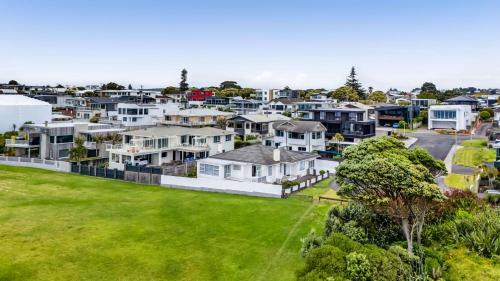 an aerial view of a suburb with houses at No 1 Beachfront Holiday Home in New Plymouth