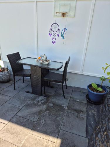 a patio with a table and two chairs at Craignish Retreat in Takura