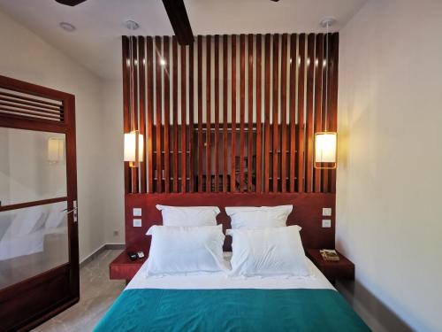 Ένα ή περισσότερα κρεβάτια σε δωμάτιο στο Studio Shokola - Deshaies centre