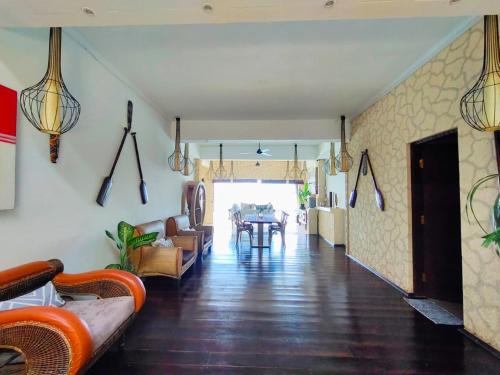 a living room with a couch and a table at Villa Umbrella Lombok in Senggigi 