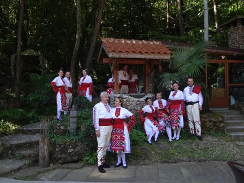 a group of people in national costumes posing for a picture at Hotel Saint Nedelya in Kolarovo