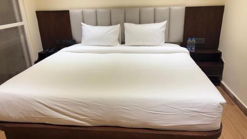 Ένα ή περισσότερα κρεβάτια σε δωμάτιο στο BAELTREE HOTEl