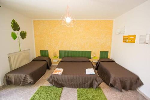Cama o camas de una habitación en Le Cromie Catignano