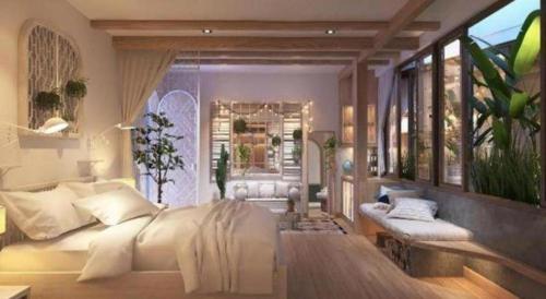 a bedroom with a large bed and a large window at Nap Am - Dalat in Ấp Kim Thạch