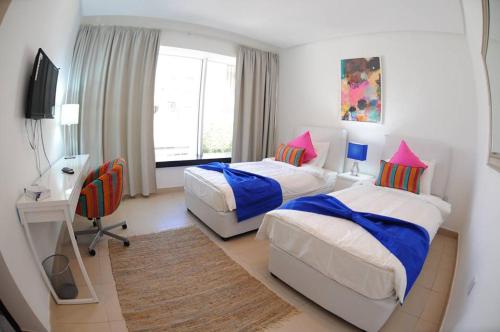 Una cama o camas en una habitación de Prime Hotel