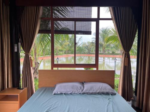 Ένα ή περισσότερα κρεβάτια σε δωμάτιο στο Melalueca homestay