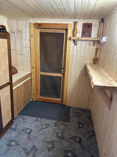 an inside view of a room with a door at Chata v údolí in Rozbehy