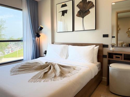 Ένα ή περισσότερα κρεβάτια σε δωμάτιο στο Gloria's Laguna Suite