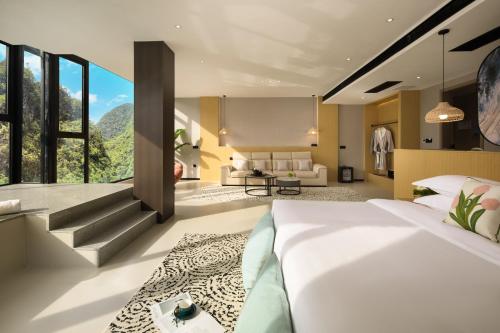 Ένα ή περισσότερα κρεβάτια σε δωμάτιο στο Xingyun Mujing Hotel