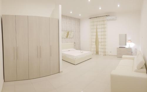 Una cama o camas en una habitación de Palazzo D'Atri