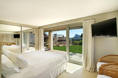 Ένα ή περισσότερα κρεβάτια σε δωμάτιο στο Pringle Bay Villa