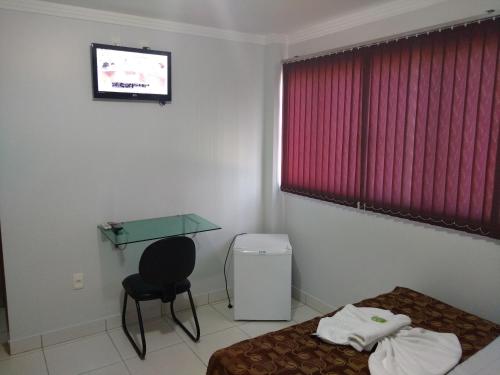 Кровать или кровати в номере Euro Plaza Hotel - Próximo ao Aeroporto de Goiânia, Santa Genoveva
