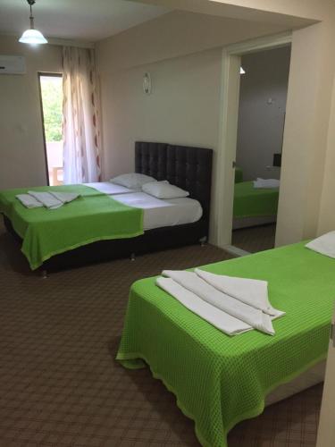 Una cama o camas en una habitación de Anatolia Hotel