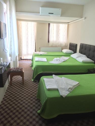 Postel nebo postele na pokoji v ubytování Anatolia Hotel
