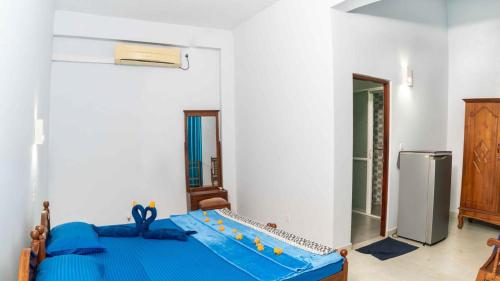 Ένα ή περισσότερα κρεβάτια σε δωμάτιο στο Hotel Blue Sapphire