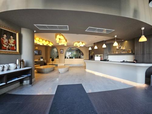 a lobby with a bar and a waiting room at I Pavilion Hotel Phuket in Phuket