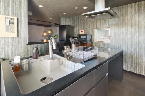 Kuchyň nebo kuchyňský kout v ubytování マイグレ南青山