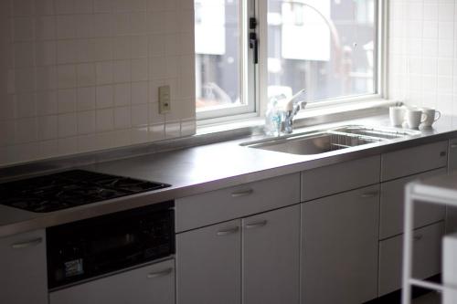 Η κουζίνα ή μικρή κουζίνα στο Seaside Inn Hokuto