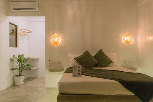 En eller flere senge i et værelse på SAMPA El Nido