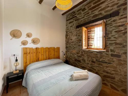 Ένα ή περισσότερα κρεβάτια σε δωμάτιο στο Casa Crisantemo with sea view and pool in Adra