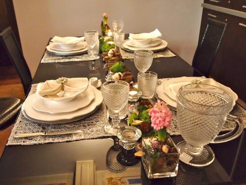 a table with plates and dishes on top of it at Parizzi Suites & Restaurant in Parma