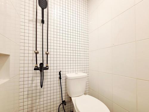 Ένα μπάνιο στο Urbanview Hotel Langkung Sae Magelang