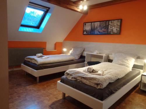 Postel nebo postele na pokoji v ubytování Gîte Fischer