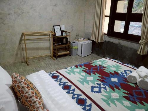 Ένα ή περισσότερα κρεβάτια σε δωμάτιο στο Banna Cafe & Glamping บ้านนา คาเฟ่ แอนด์ แกรมปิ้ง