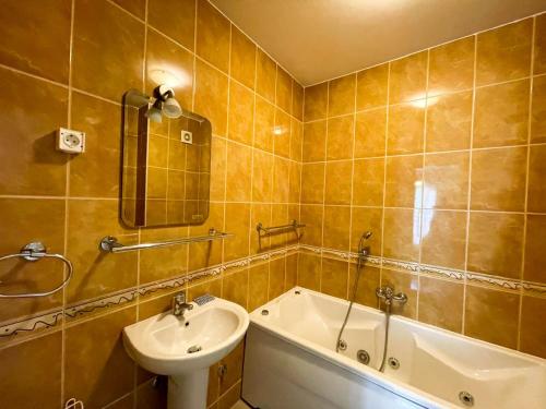 a bathroom with a sink and a bath tub and a sink at Kotor Vista Seaview 2 apartment by MN Property in Muo