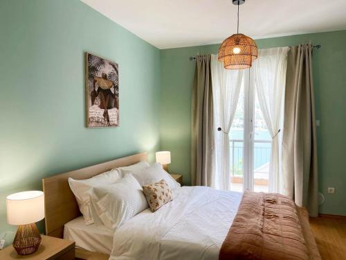 a bedroom with a bed and a large window at Kotor Vista Seaview 2 apartment by MN Property in Muo