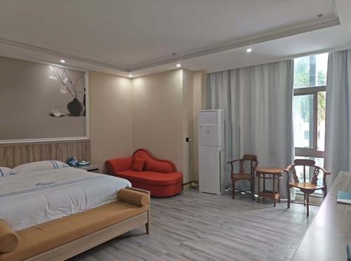 En eller flere senge i et værelse på Haimeng International Hotel