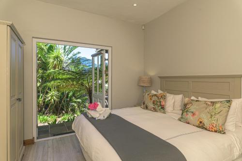 En eller flere senge i et værelse på Villa Blu Guesthouse