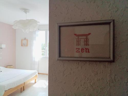 Ένα ή περισσότερα κρεβάτια σε δωμάτιο στο Le Mauzac chambre Zen