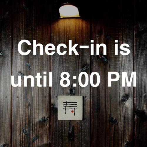 a sign on a wooden door that says check in is until pm at kotobukian 寿庵 in Awaji
