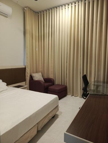 En eller flere senge i et værelse på Rayyan homestay