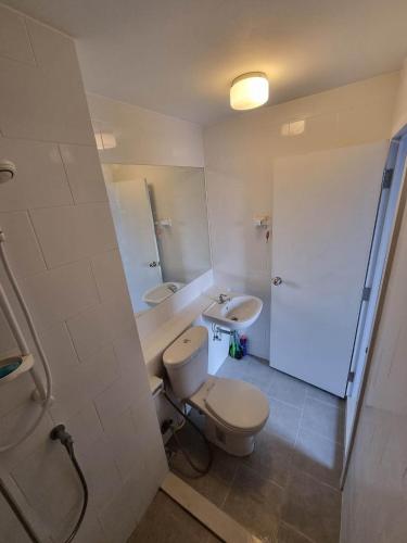 a bathroom with a toilet and a sink at Plum condo Bang-yai station in Nonthaburi