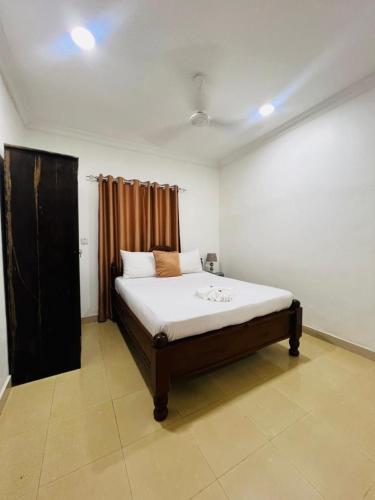 En eller flere senge i et værelse på Vuga Town House