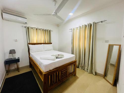 En eller flere senge i et værelse på Vuga Town House