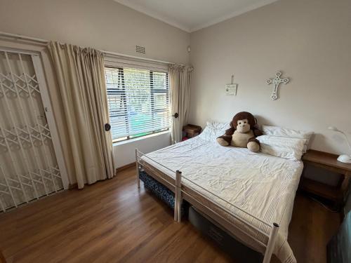 Ένα ή περισσότερα κρεβάτια σε δωμάτιο στο Family Home with Big Garden & Jacuzzi