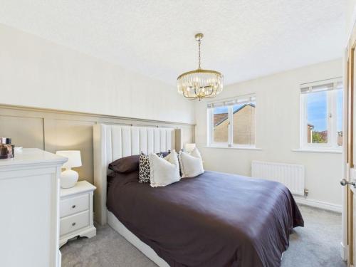 Ένα ή περισσότερα κρεβάτια σε δωμάτιο στο The Haven Holiday Home