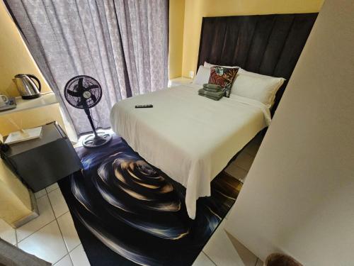 Ένα ή περισσότερα κρεβάτια σε δωμάτιο στο Sunrise Guest house