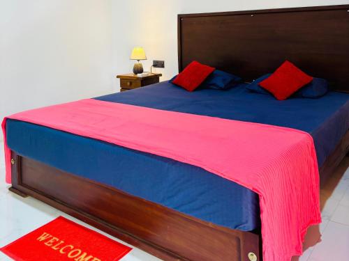 Un pat sau paturi într-o cameră la Amuna Villa