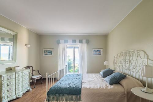 En eller flere senge i et værelse på Moradia Milú frente à praia