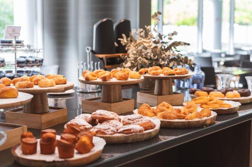 a bunch of different types of pastries on a counter at Abba Huesca in Huesca