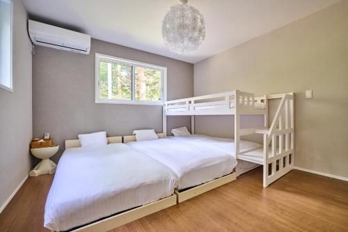 Postel nebo postele na pokoji v ubytování ヘルシンキ