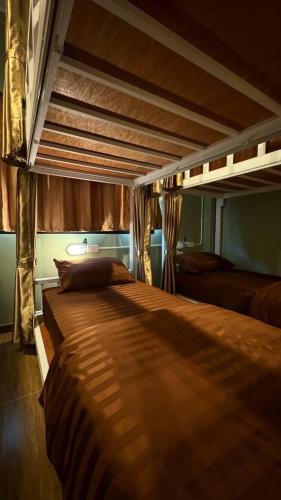 a large bed in a room with at Cups house คัพเฮาส์ in Pai
