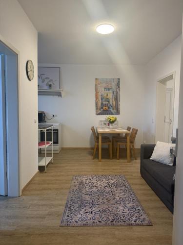 a living room with a couch and a table at Wupper Apartments Vogel in Erbschlö