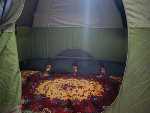 a bedroom with a bed in a tent at Meemure Nature Camp in Hunnasgiriya